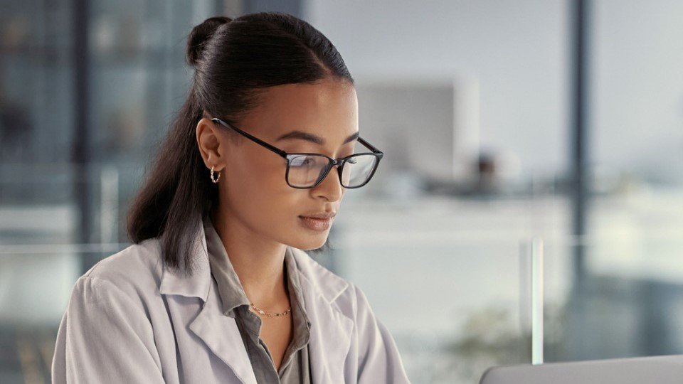 Doctor using laptop