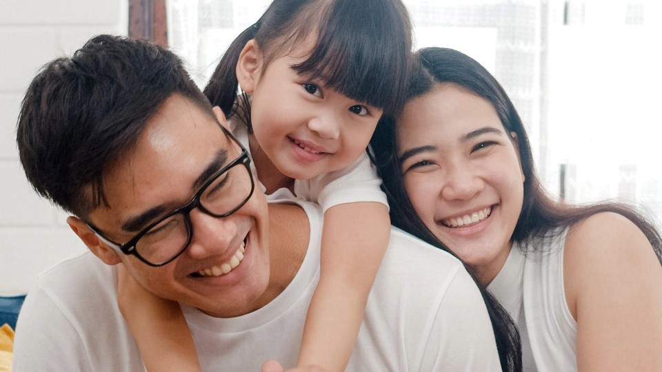Father laughing with his children