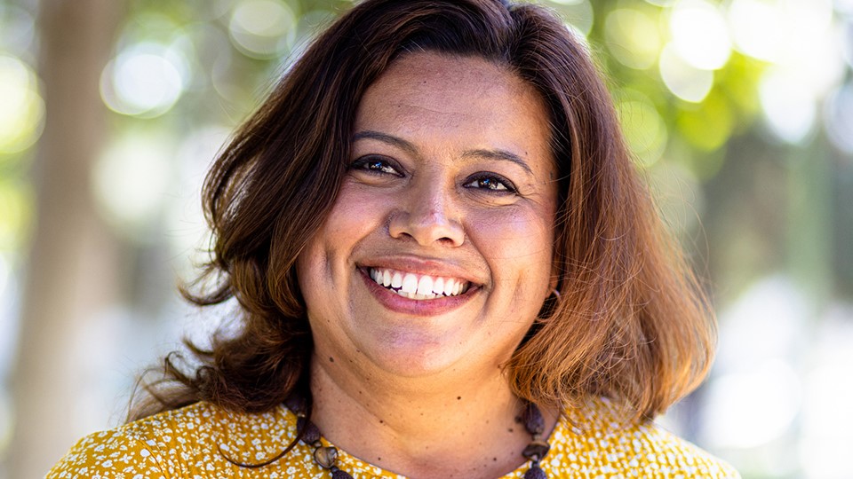 Portrait of woman smiling outdoors