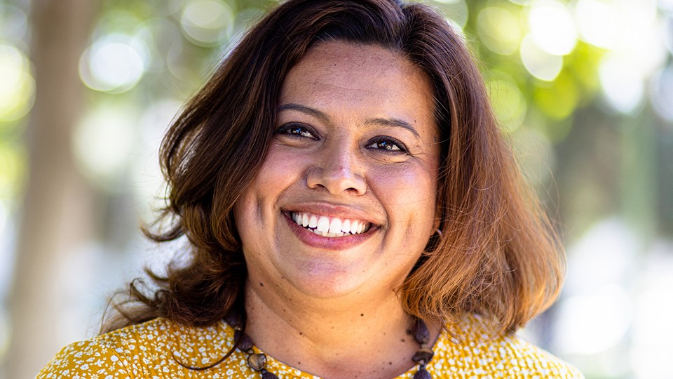 Portrait of woman smiling outdoors