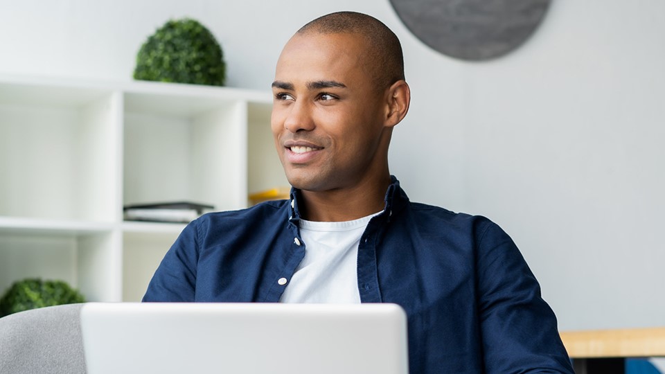 Portrait of a man working on his laptop