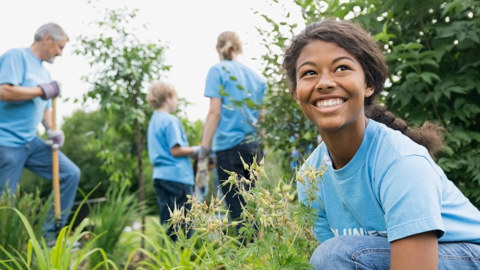 Group of volunteers working together in a garden
